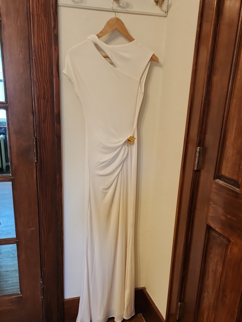 Meshki Cream One-Shoulder Draped Maxi Dress with Gold Accent Brooch
